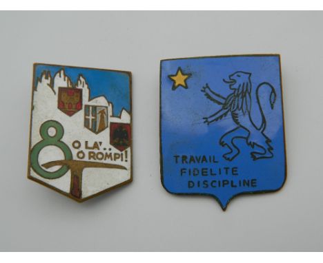 Two enamel badges