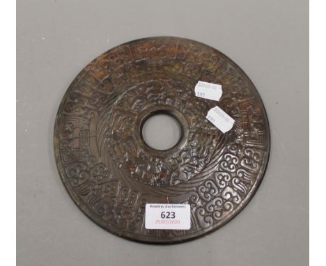 A Chinese carved jade bi disc. 20 cm diameter.