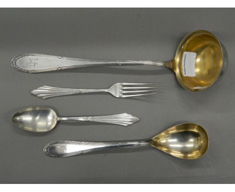 Four pieces of WMF cutlery.  Ladle 30 cm long. 