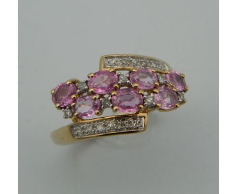 A 9 ct gold diamond and pink sapphire ring. Ring size M