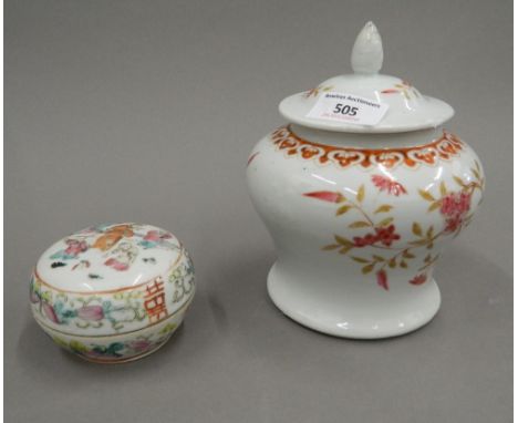 A 19th century Chinese porcelain baluster vase and cover painted with pink flowers and iron red lappets, with seal mark to ba