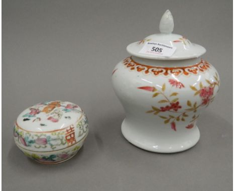 A 19th century Chinese porcelain baluster vase and cover painted with pink flowers and iron red lappets, with seal mark to ba