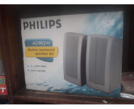 A boxed Philips active surround speaker kit 