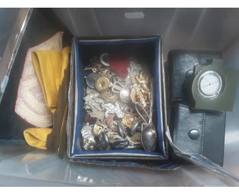 A box of military badges, buttons, compass, patches etc 