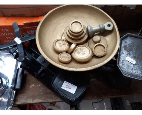 2 sets of kitchen scales with weights 