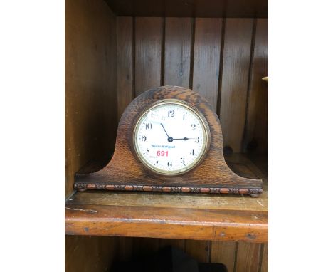 An oak cased mantel clock 