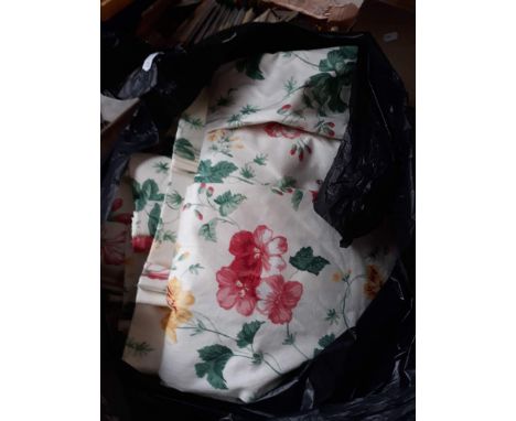 A bag containing 3 sets of curtains 