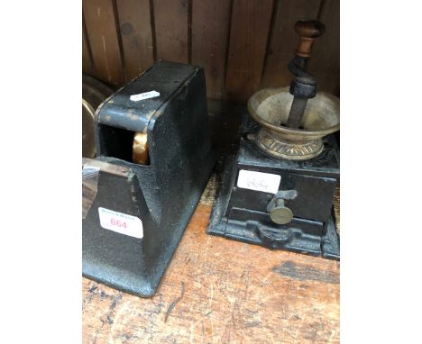 An old tape dispenser and an old coffee grinder 