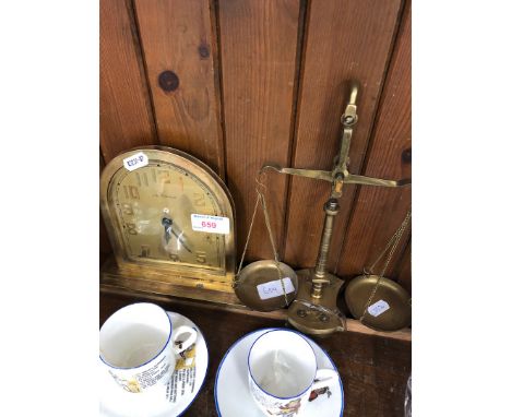 A brass mantle clock by C. Bucherer and small brass scales 