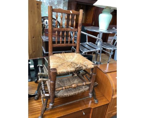 A ladder back chair and rush seated stool. 