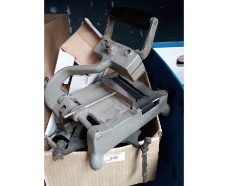 A box containing Aldis projector, scales and hand cranked sewing machine 