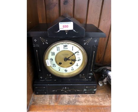 A black slate mantle clock by E&F Turnbull, Newcastle on Tyne. 