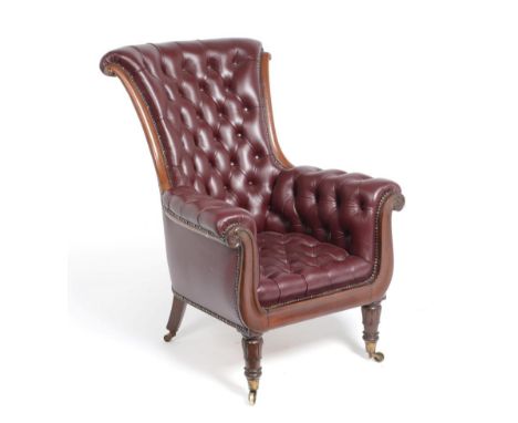 A Mahogany and Red Leather Button Close-Nailed Armchair, circa 1840, the padded back support, arms and seat with moulded fram