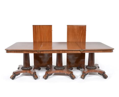 A William IV Mahogany Triple Pillar Dining Table, 2nd quarter 19th century, of rounded rectangular form with plain frieze, ra