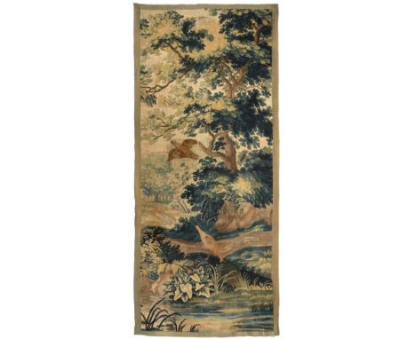 A 17th Century Aubusson Tapestry Fragment Central France Woven in silk and wool.  The field depicting a rural scene of plants
