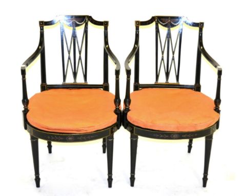 A Pair of Sheraton Period Ebonised and Painted Armchairs, late 18th century, the top rails painted with an urn and swags abov