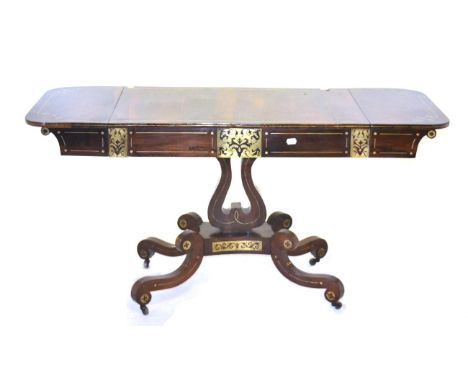 A Regency Rosewood and Brass Inlaid Sofa Table, early 19th century, with two rounded drop leaves above two real and two sham 