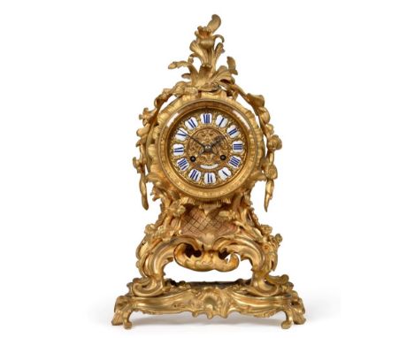 An Ormolu Striking Mantel Clock, signed Raingo Freres, Paris, circa 1850, scroll and floral decorated case raised upon a matc