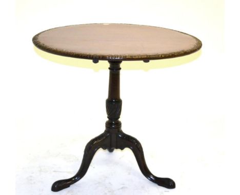 A George III Mahogany Tilt-top Tripod Table, late 18th century, the circular top with acanthus carved edge, raised on a turne