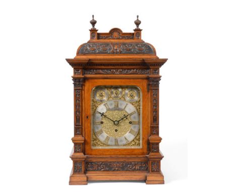 An Oak Chiming Table Clock, signed Russells, Maker To The Queen, Liverpool, circa 1890, caddied top with carved swag recessed