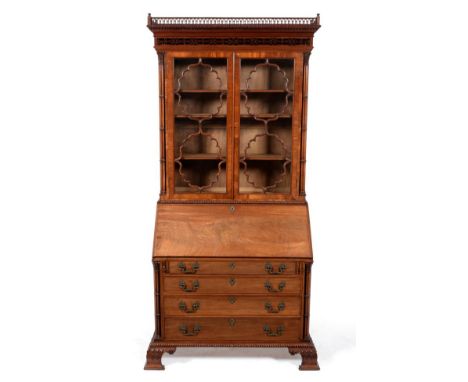 A Fine Carved Mahogany Chippendale Style Bureau Bookcase, by E W Varley, dated 1924, the gothic style pierced gallery above a