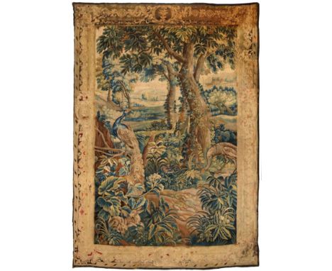 A Late 17th/Early 18th Century Aubusson Tapestry Central France The field depicting a wooded landscape with exotic birds and 