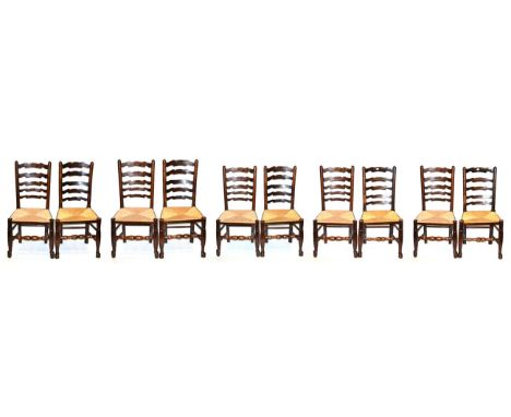 A Harlequin Set of Ten Ash and Elm Rush Seated Chairs, 19th century, with five horizontal ladder back supports above rush sea