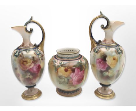 A pair of Royal Worcester blush ivory ewers, height 17cm, and a further pot pourri pot. CONDITION REPORT: One ewer with resto