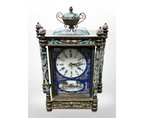A champleve enamel mantel clock containing a battery movement, height 28 cm 