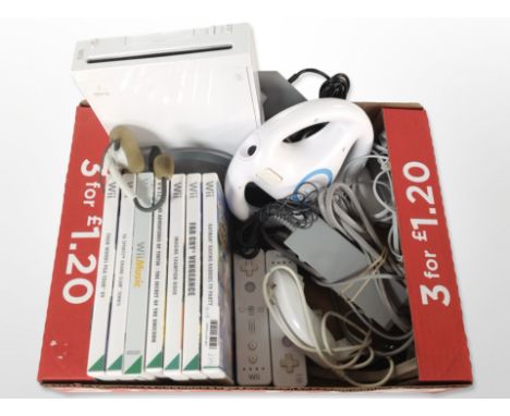 A Nintendo Wii console, accessories and several games. (1 box)