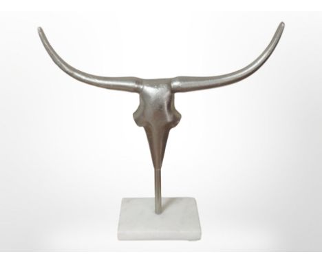 A cast metal Steer skull on plinth, height 37 cm