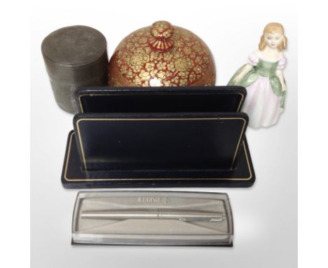 A group of items including Chinese cylindrical pewter tea caddy, Parker pen, desk correspondence stand, Royal Doulton figurin