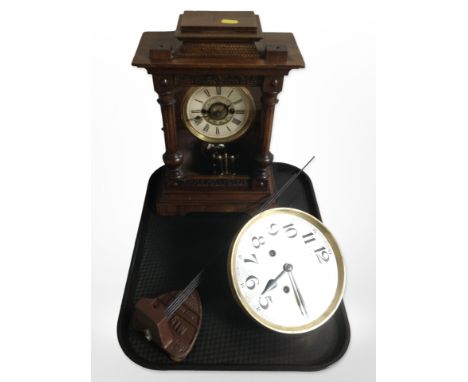 An early-20th century walnut mantel clock, together with a further wall clock movement with silvered dial.