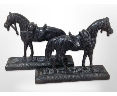 A pair of cast iron horse door stops, height 20 cm