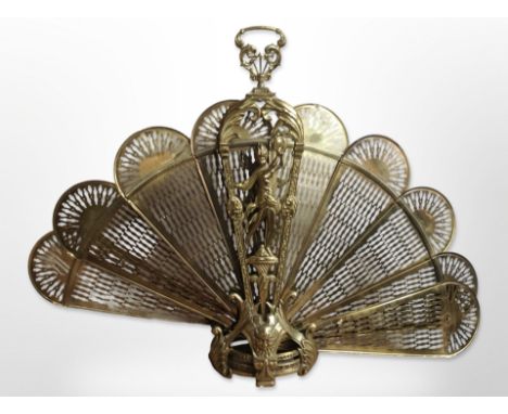 A brass 'peacock' fire screen, height 85cm.