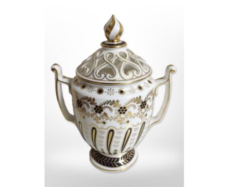 A Royal Worcester Worcester Heritage Collection twin-handled porcelain vase with pierced lid, height 18.5cm.