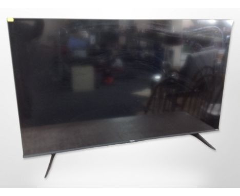 A Hisense 54-inch LCD TV with lead, remote and manual.