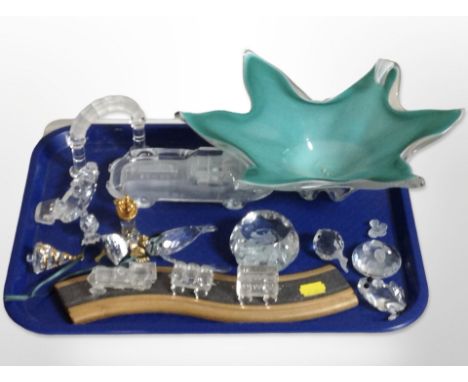 A group of crystal paperweights including Swarovski pieces, studio glass bowl, crystal model of a car, etc.
