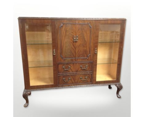 A figured walnut glazed drinks cabinet on pad feet, 137 cm wide x 35 cm deep x 117 cm high 
