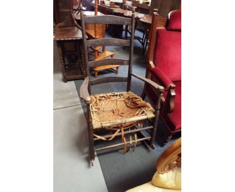 A rare early 20thC 'Shakers' no.6 rocking chair with ladder back and tape woven seat with original transfer label, stamped 'N