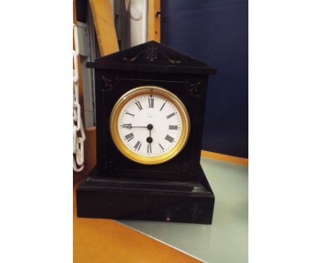 A Victorian French slate mantel clock of architectural form having white enamel dial and Roman numerals, indistinctly signed 
