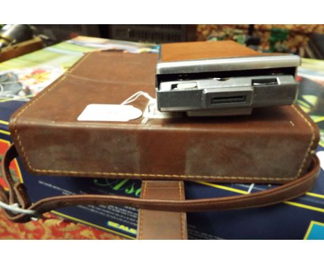 A vintage leather cased Polaroid camera