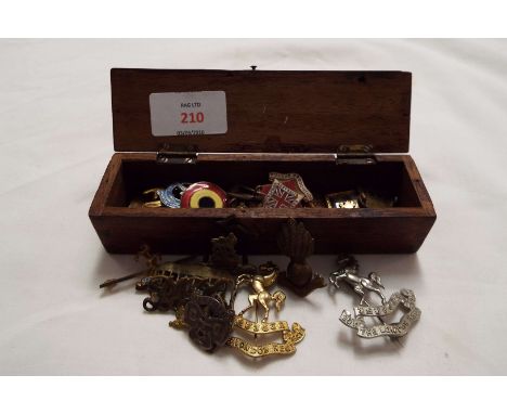 A mixed selection of enamel badges and other to include The London Regiment, Imperial Constabulary etc