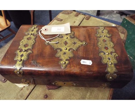 A Victorian walnut brass bound games box the domed top opening to reveal four section card tray and central brass cribbage bo