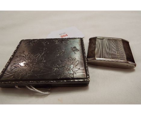 A silver Garanite Zunder No 60 lighter and white metal cigarette case
