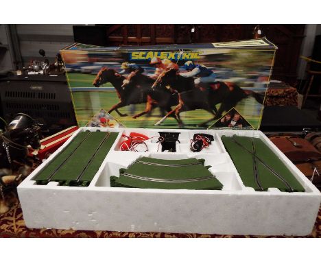 A Scalextric 'Ascot' electric horse racing game, boxed      Two horses present and in good condition although outer box sleev