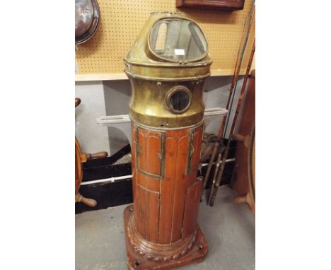 A mid-20thC ships binnacle having a teak and brass bound body with a Henry Hughs compass