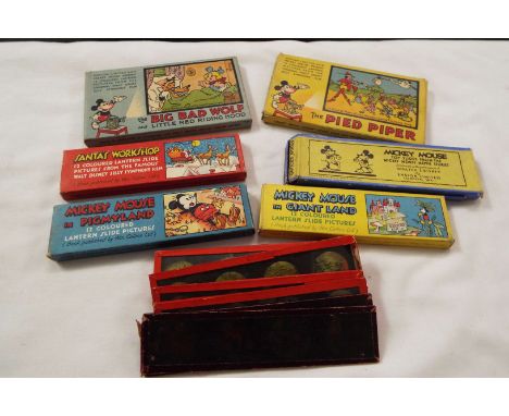 Six boxed sets of vintage Mickey Mouse glass magic lantern slides to include Rigmyland, Giant Land of the Big Bad Wolf etc pl