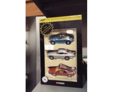 A Corgi 007 The Definitive Collection boxed three piece set comprising of BMW Z3, Aston Martin DB5 and a Lotus Esprit Turbo