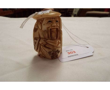 An ivory netsuke of a gentleman